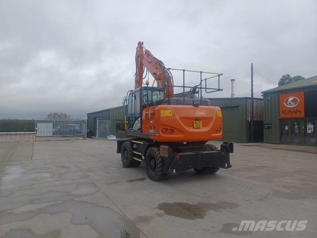 Hitachi 140W Pelle sur pneus