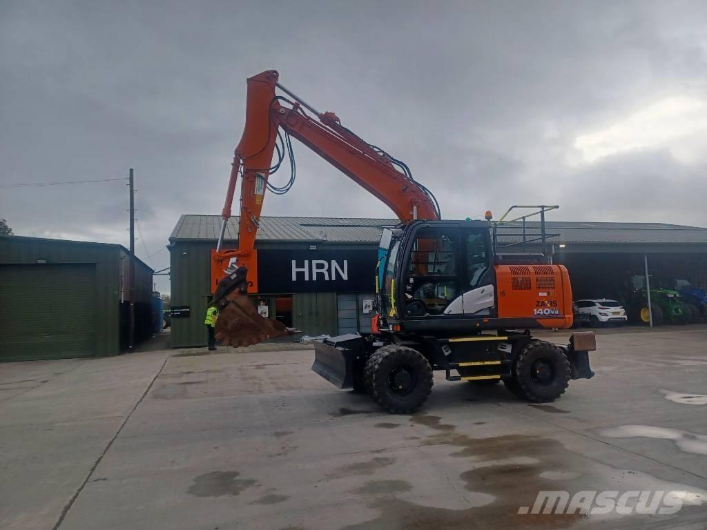 Hitachi 140W Pelle sur pneus