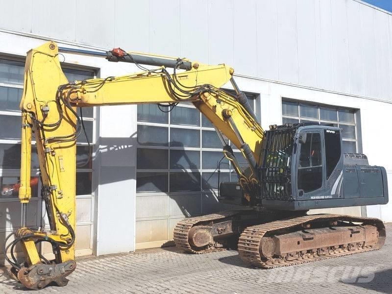 New Holland E 265 C Pelle sur chenilles