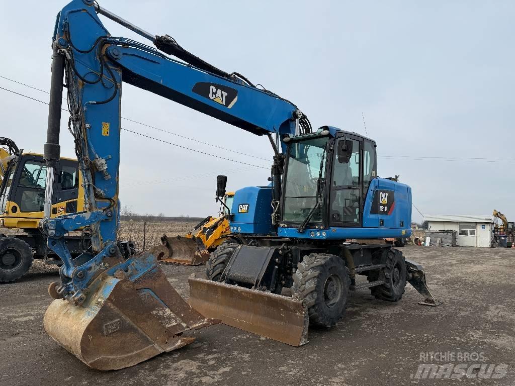 CAT M 318 F Pelle sur pneus