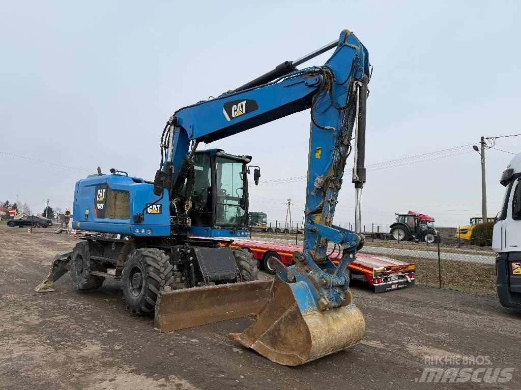 CAT M 318 F Pelle sur pneus