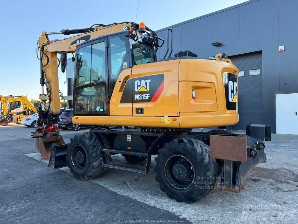 CAT M315F Pelle sur pneus