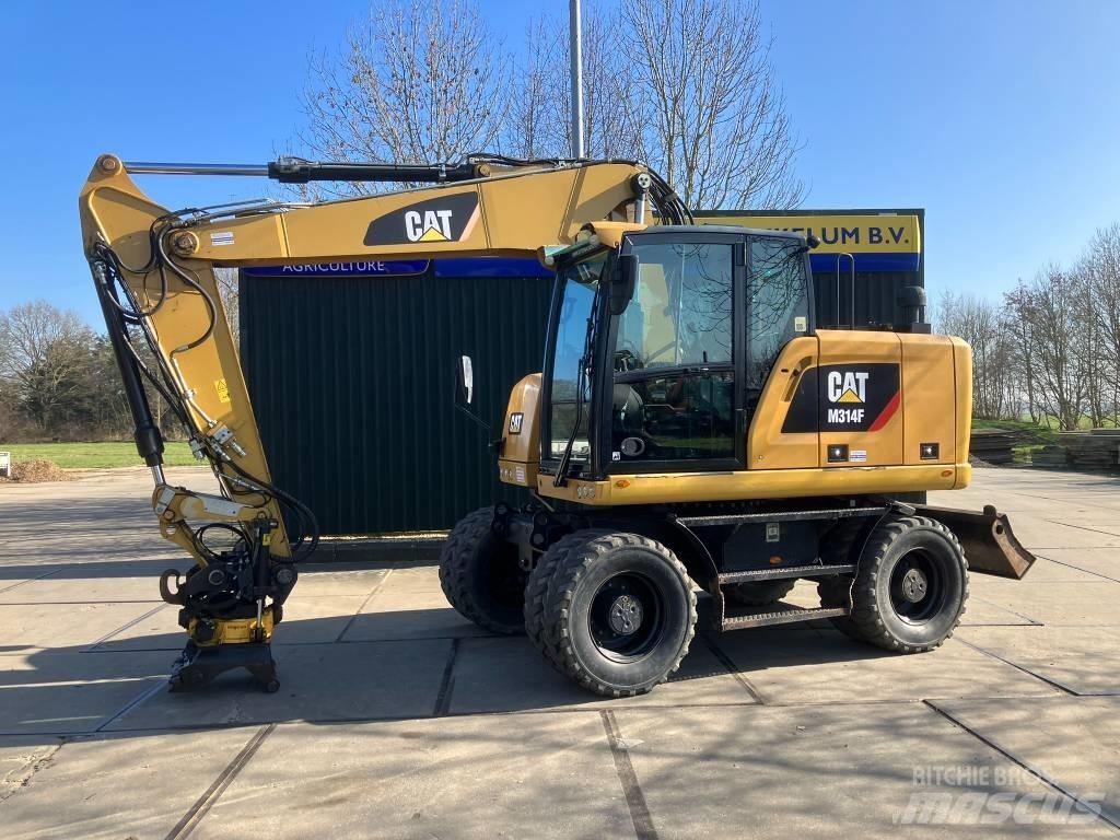 CAT M314F Pelle sur pneus