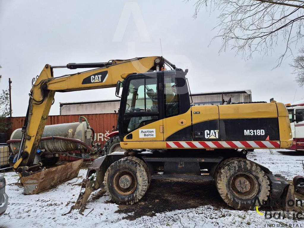 CAT M 318 D Pelle sur pneus