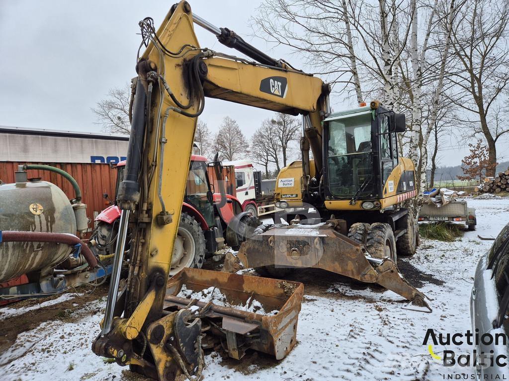 CAT M 318 D Pelle sur pneus