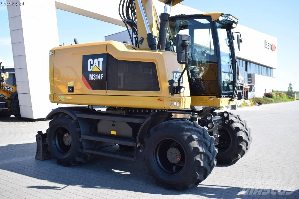 CAT M314F Pelle sur pneus