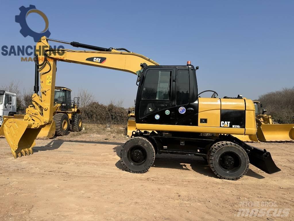 CAT M 320 D2 Pelle sur pneus