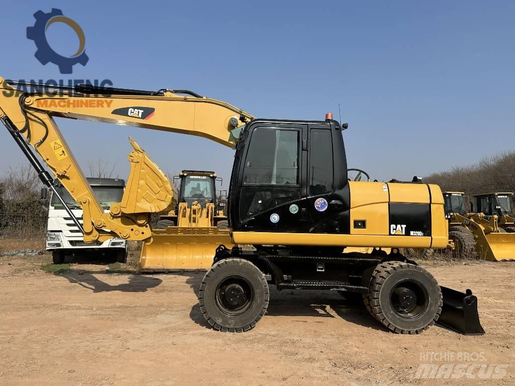 CAT M 320 D2 Pelle sur pneus
