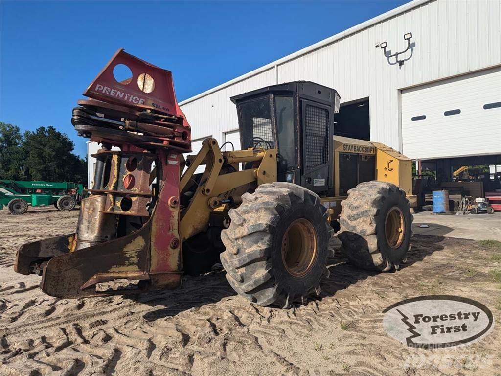 CAT 553 Abatteuse groupeuse