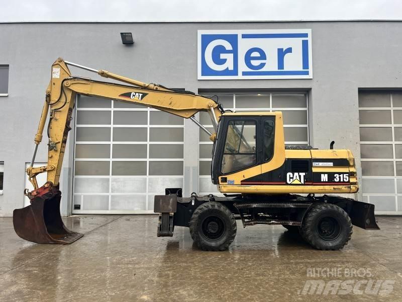 CAT M 315 Pelle sur pneus