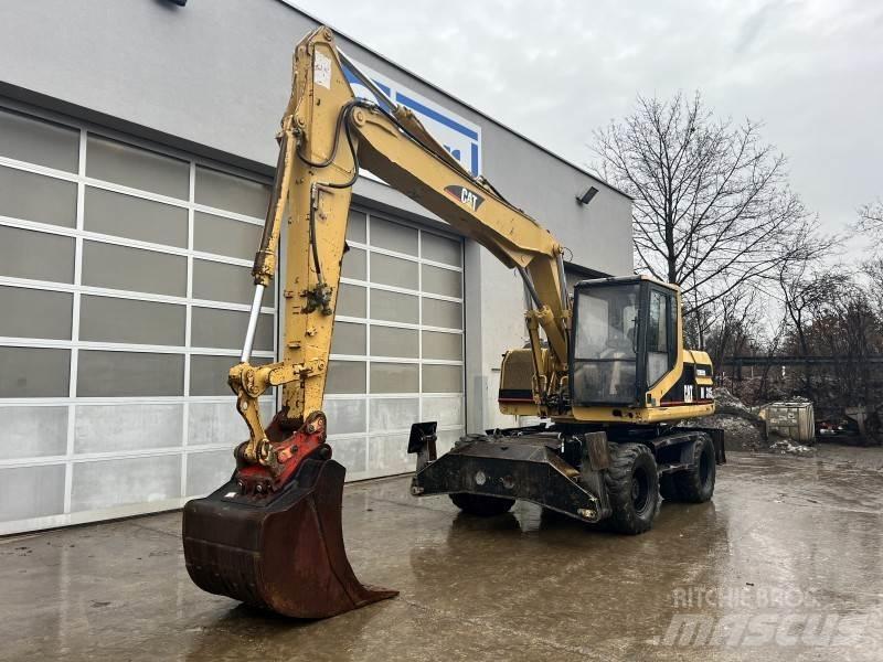 CAT M 315 Pelle sur pneus