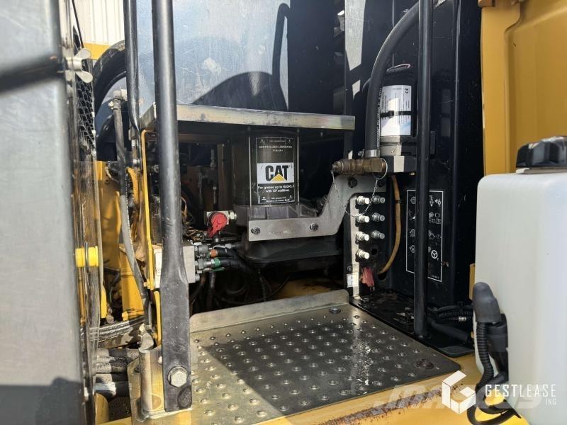 CAT M313D Pelle sur pneus