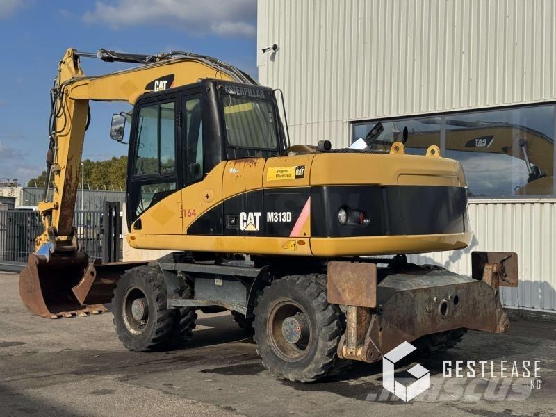 CAT M313D Pelle sur pneus