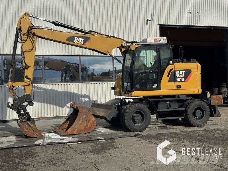 CAT M315F Pelle sur pneus