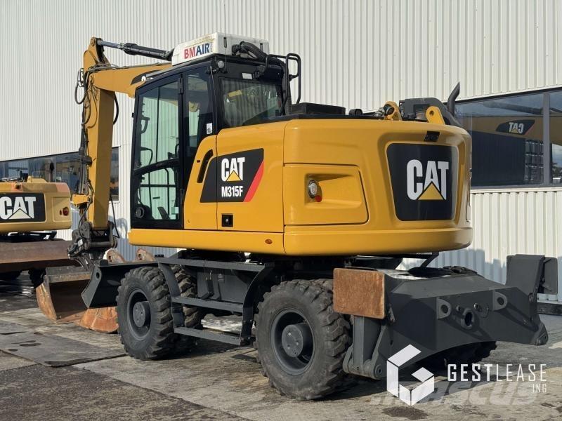 CAT M315F Pelle sur pneus