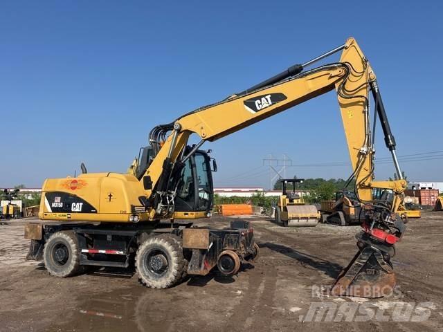 CAT M315D Pelle sur pneus