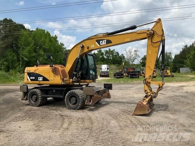 CAT M316D Pelle sur pneus