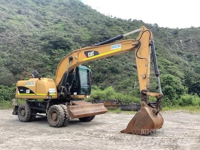 CAT M317D2 Pelle sur pneus