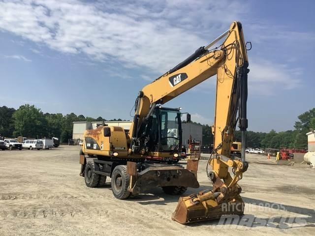 CAT M318D Pelle sur pneus