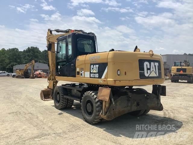 CAT M318D Pelle sur pneus