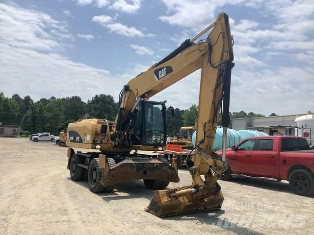 CAT M318D Pelle sur pneus