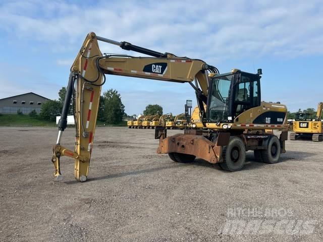 CAT M318D Pelle sur pneus