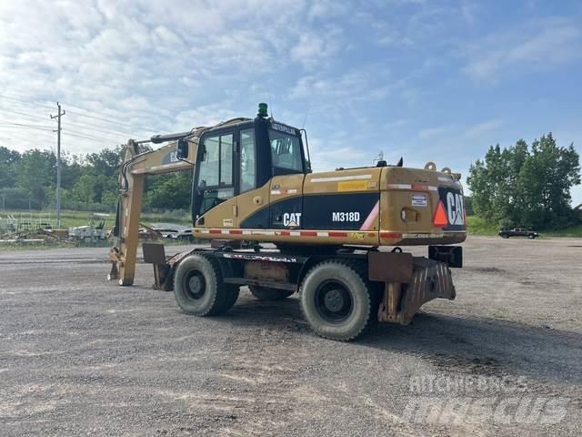 CAT M318D Pelle sur pneus