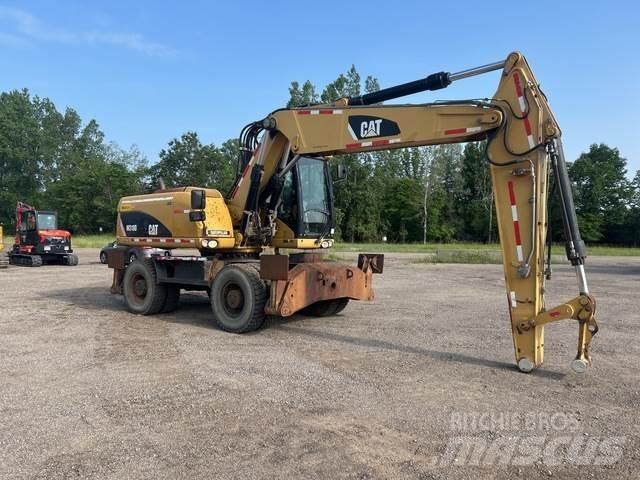 CAT M318D Pelle sur pneus