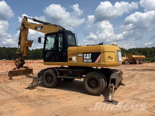 CAT M318D Pelle sur pneus