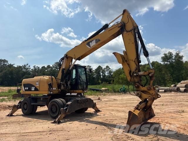 CAT M318D Pelle sur pneus
