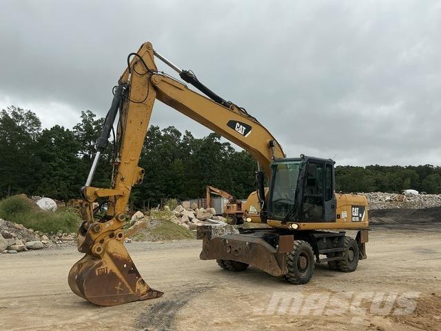 CAT M318D Pelle sur pneus