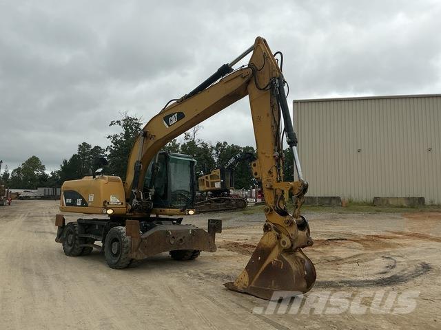 CAT M318D Pelle sur pneus
