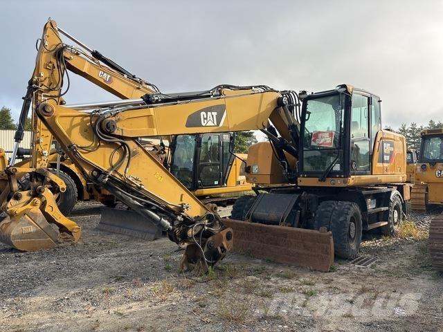 CAT M318F Pelle sur pneus