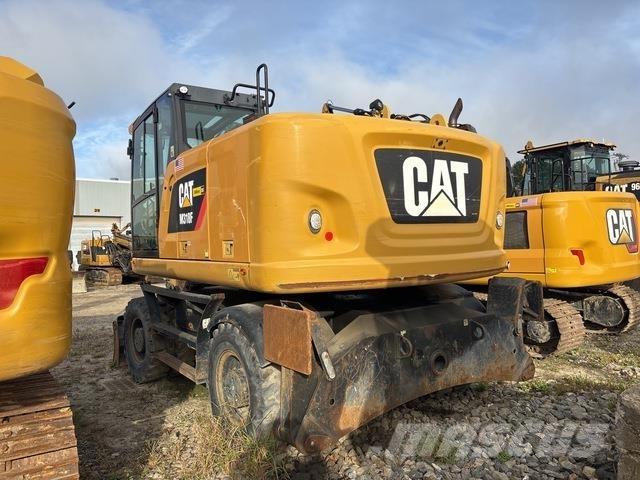 CAT M318F Pelle sur pneus