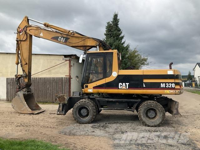 CAT M320 Pelle sur pneus
