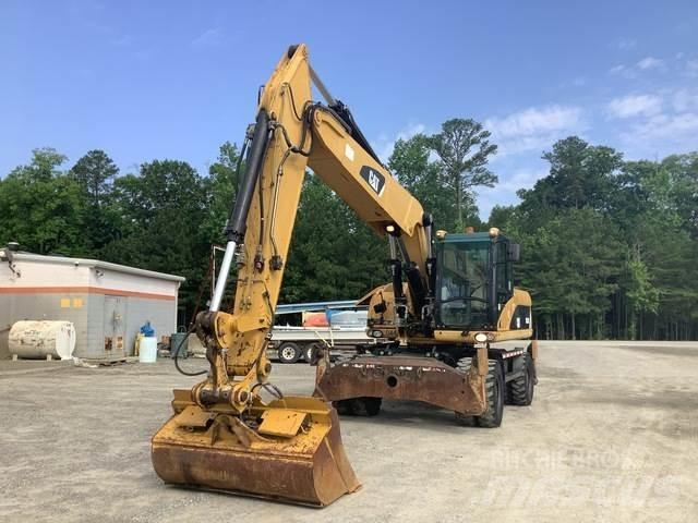CAT M322D Pelle sur pneus