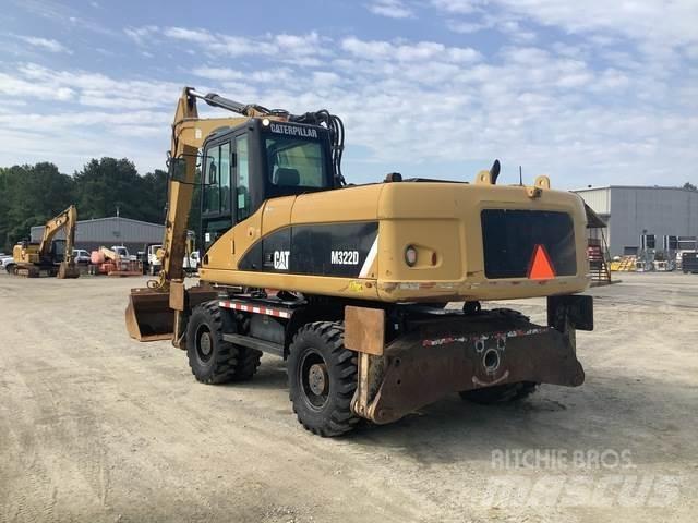 CAT M322D Pelle sur pneus