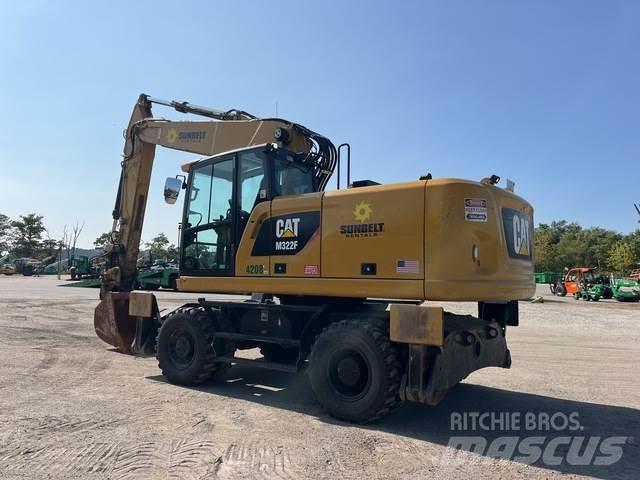 CAT M322F Pelle sur pneus