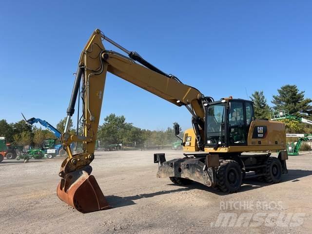 CAT M322F Pelle sur pneus
