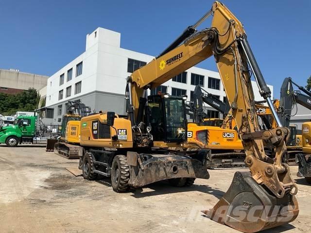 CAT M322F Pelle sur pneus