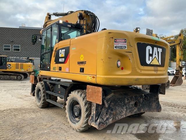 CAT M322F Pelle sur pneus