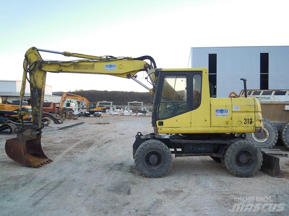 CAT M312 Pelle sur pneus