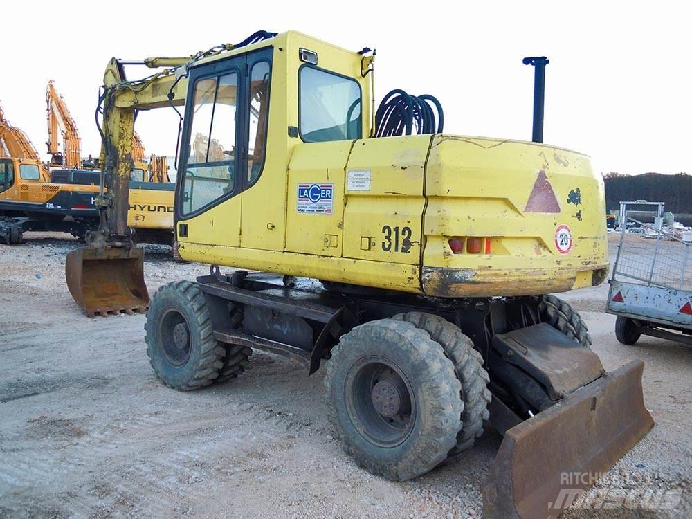 CAT M312 Pelle sur pneus