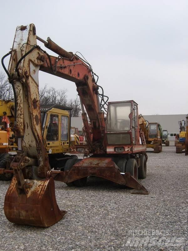 O&K MH6 Pelle sur pneus
