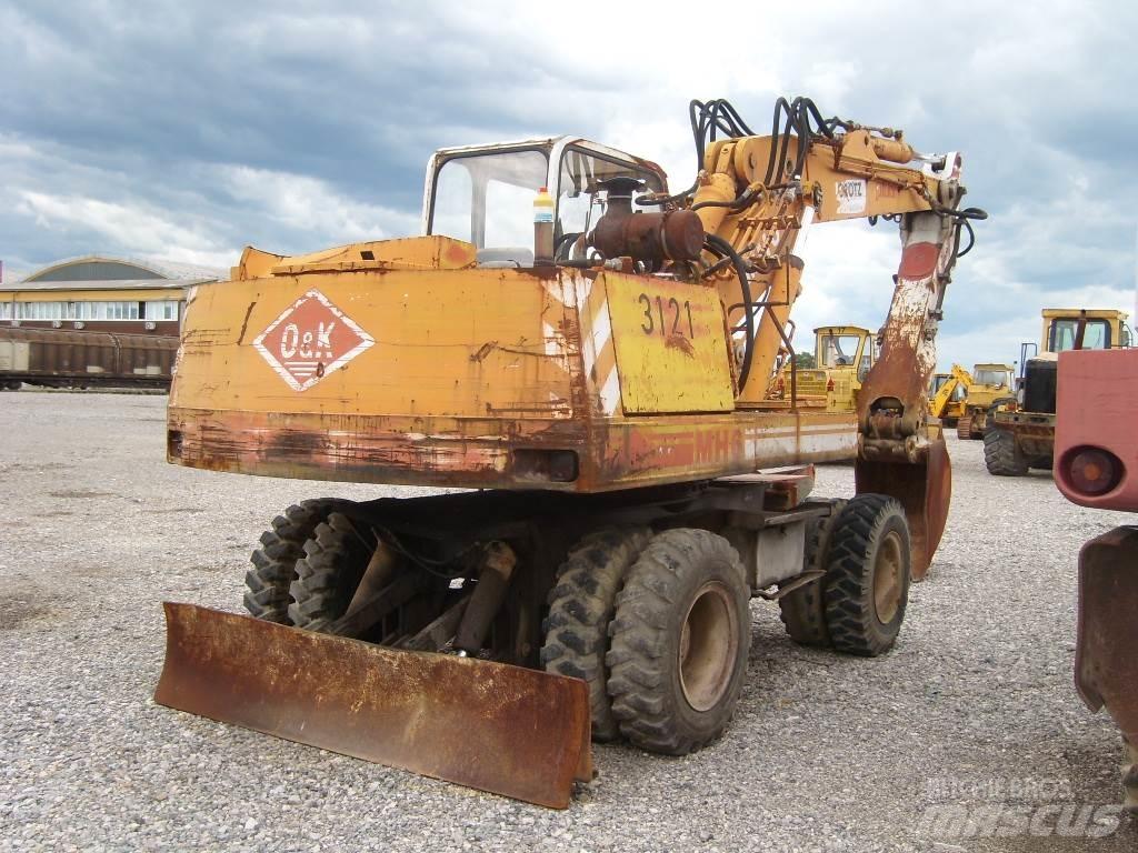 O&K MH6 Pelle sur pneus