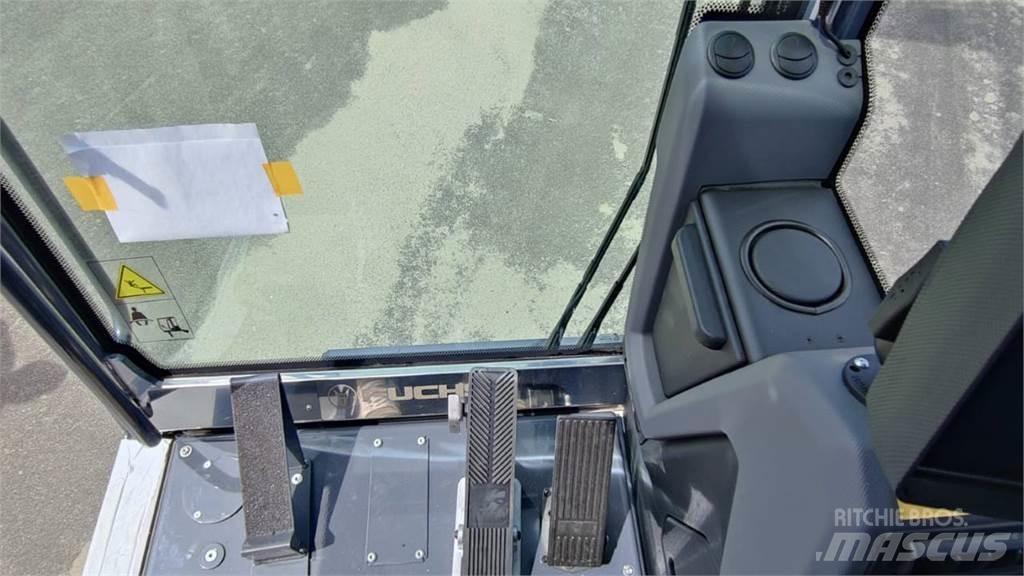 Fuchs MHL 320 Pelle sur pneus