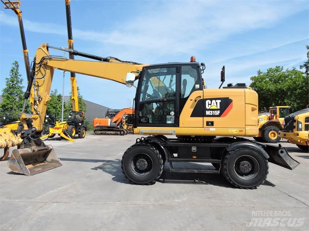 CAT M315 Pelle sur pneus