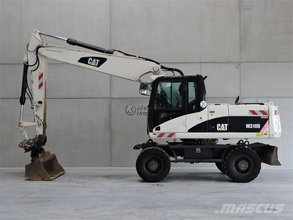 CAT M318D Pelle sur pneus