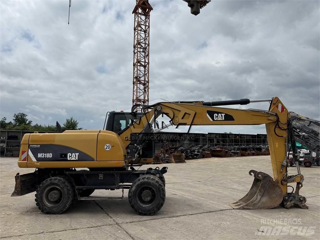 CAT M 318 D Pelle sur pneus