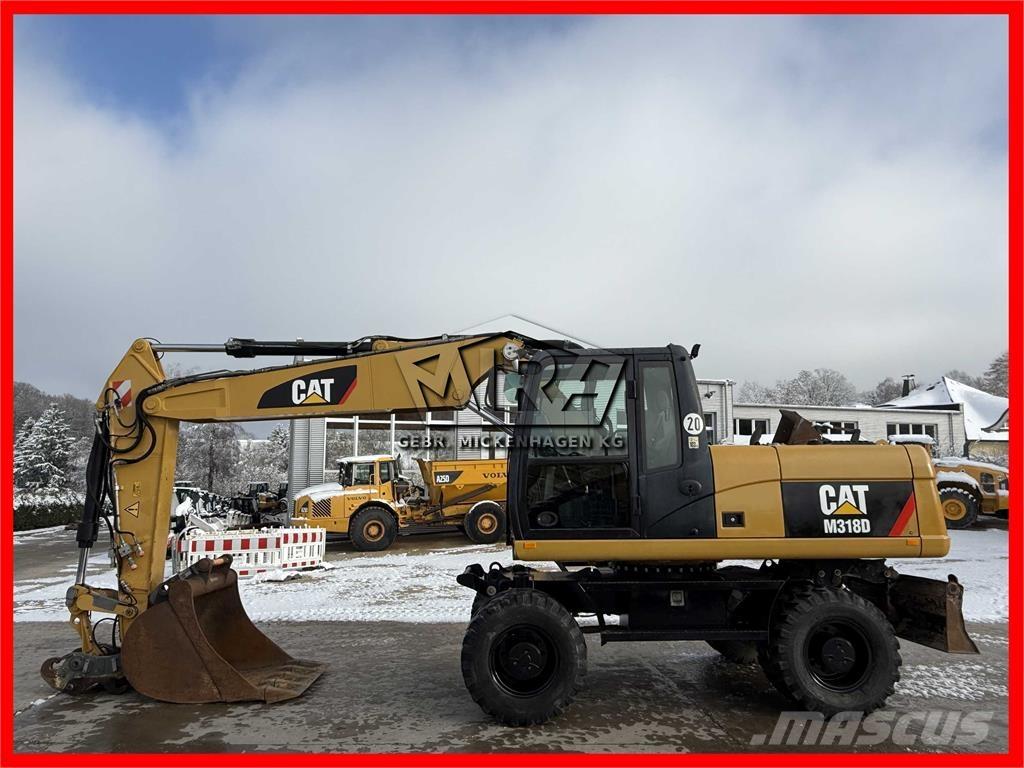 CAT M 318 D Pelle sur pneus